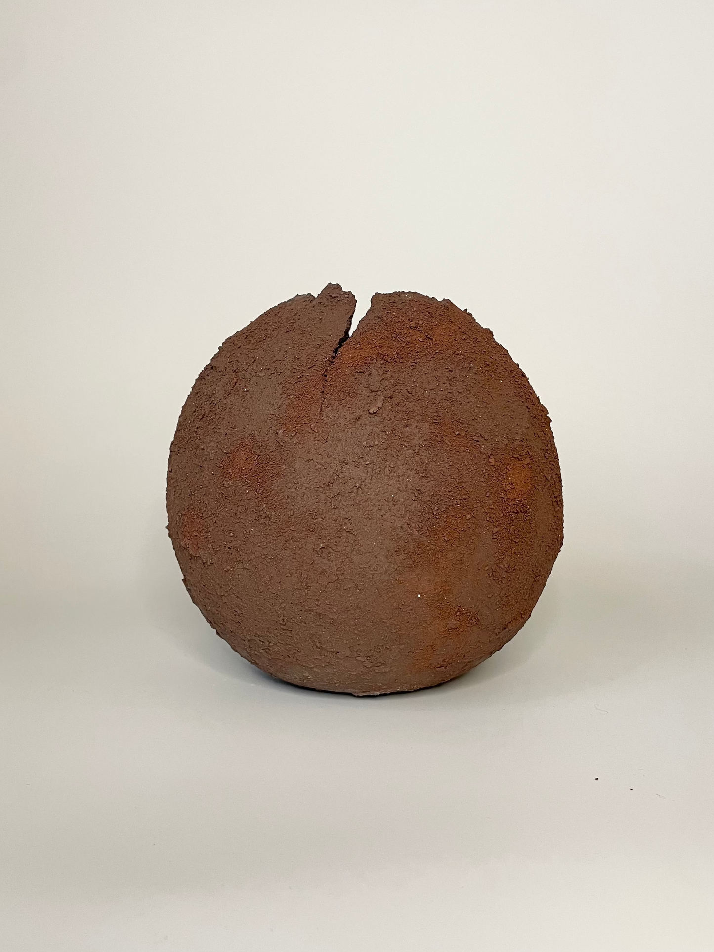 Brown spherical vessel on a white background